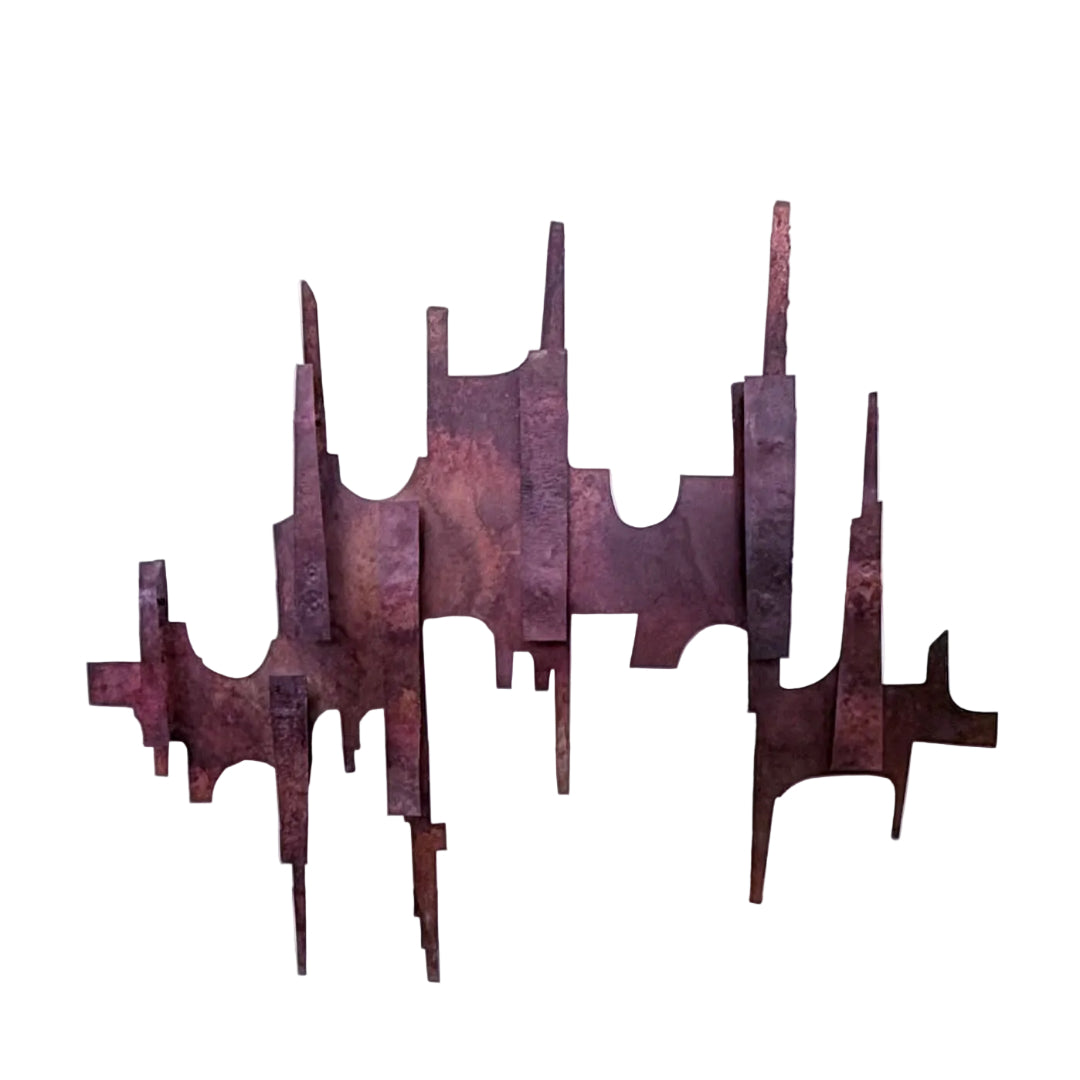 Copper wall sculpture on a white wall