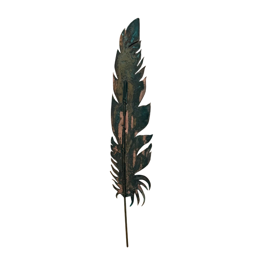 Decorative copper quill feather wall art on a white background