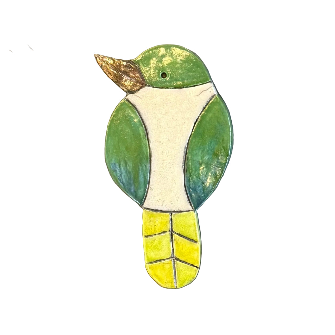 Colourful ceramic Kingfisher shaped wall tile on a white background