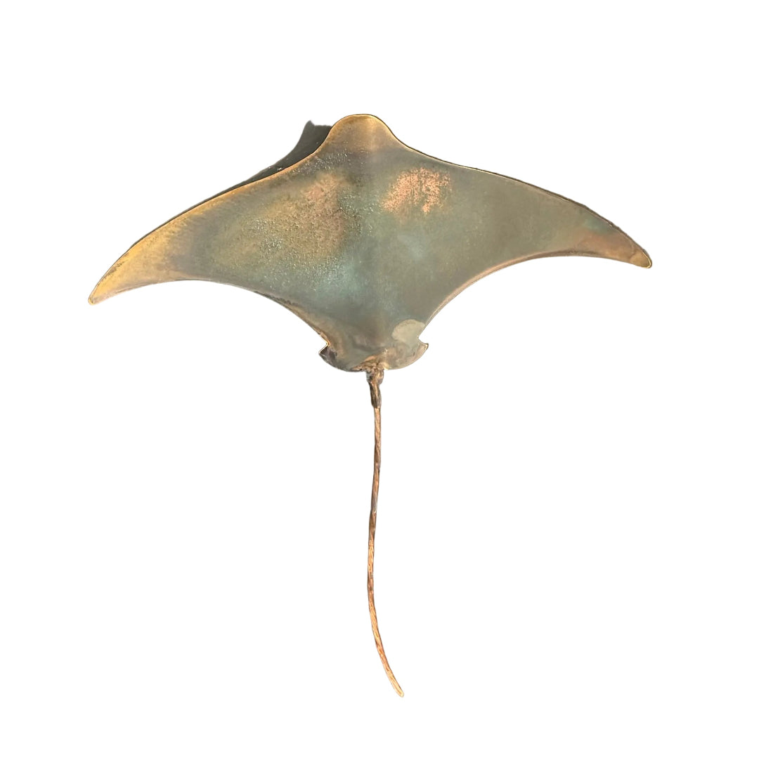 Copper stingray sculpture on a white  background