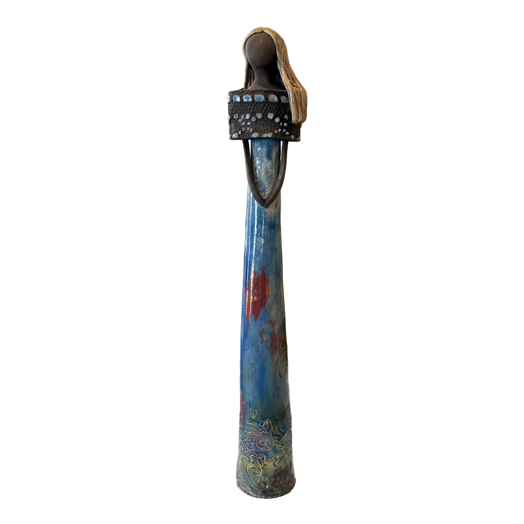 Tall blue ceramic lady sculpture on a white background