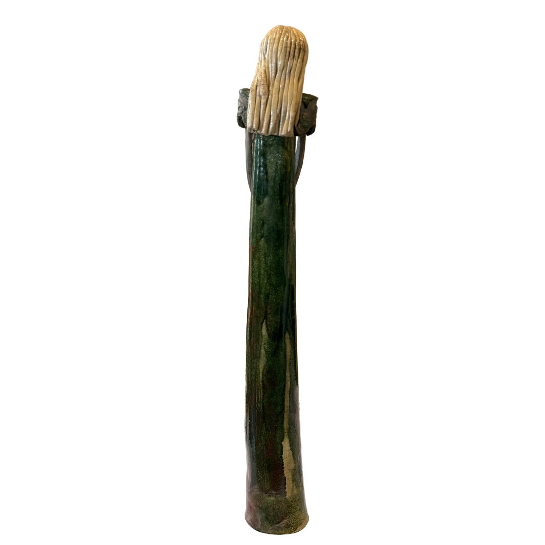 Back view of a blonde tall lady ceramic sculpture on a white background