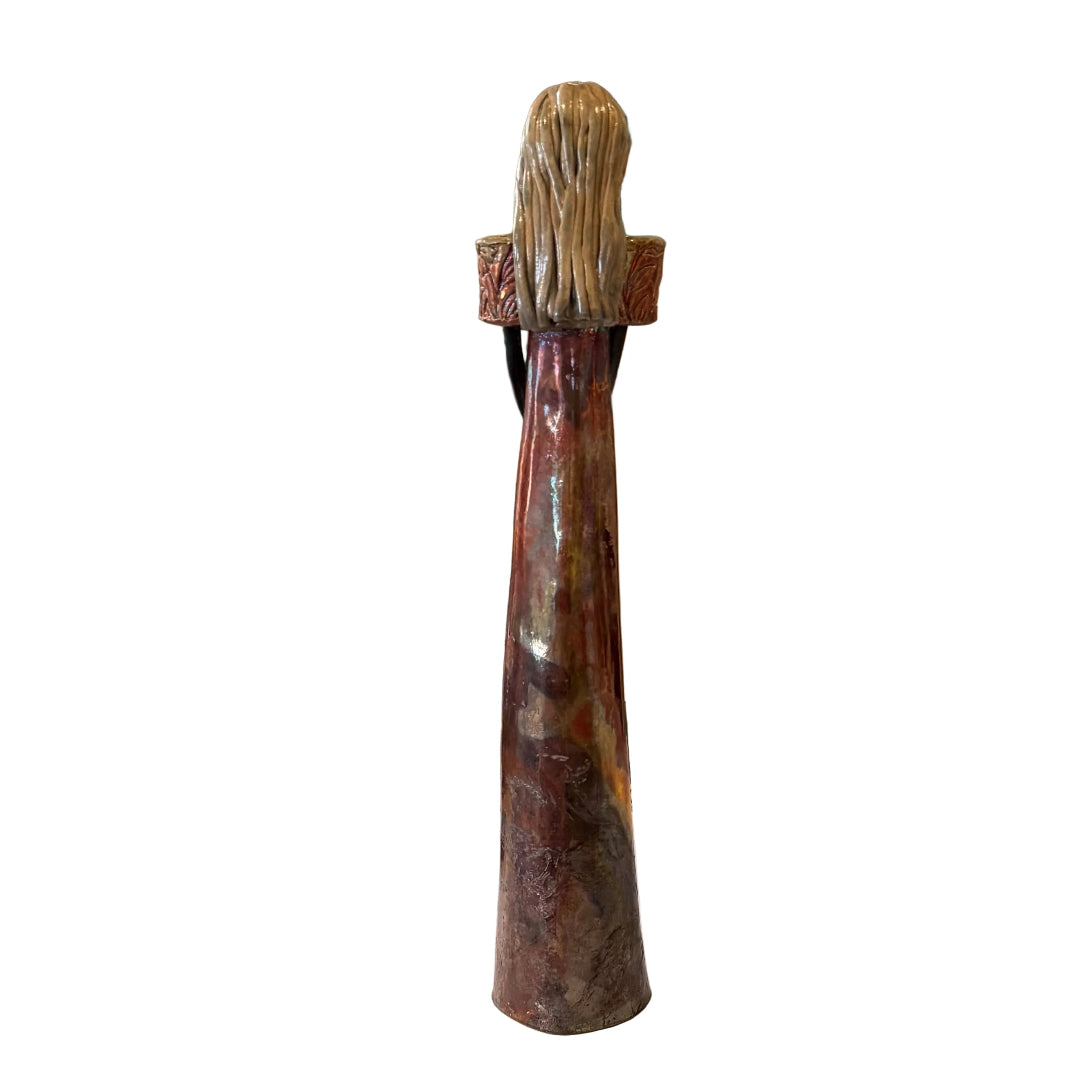 A tall, narrow ceramic sculpture with a textured, ribbed top and a glossy, mottled brown and reddish body. 