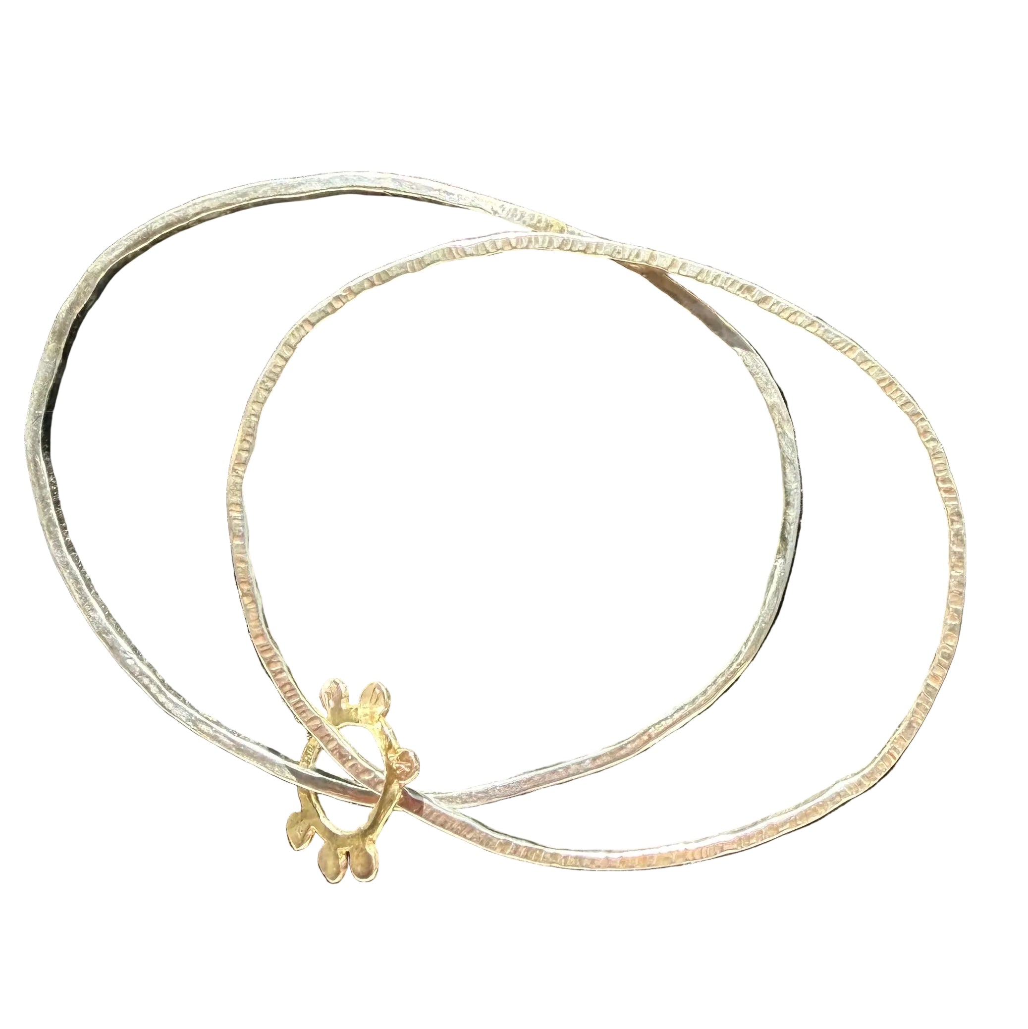 A two-layered bracelet with silver textured bands and gold-colored accents, featuring a floral Solo Sun design on one of the bands.