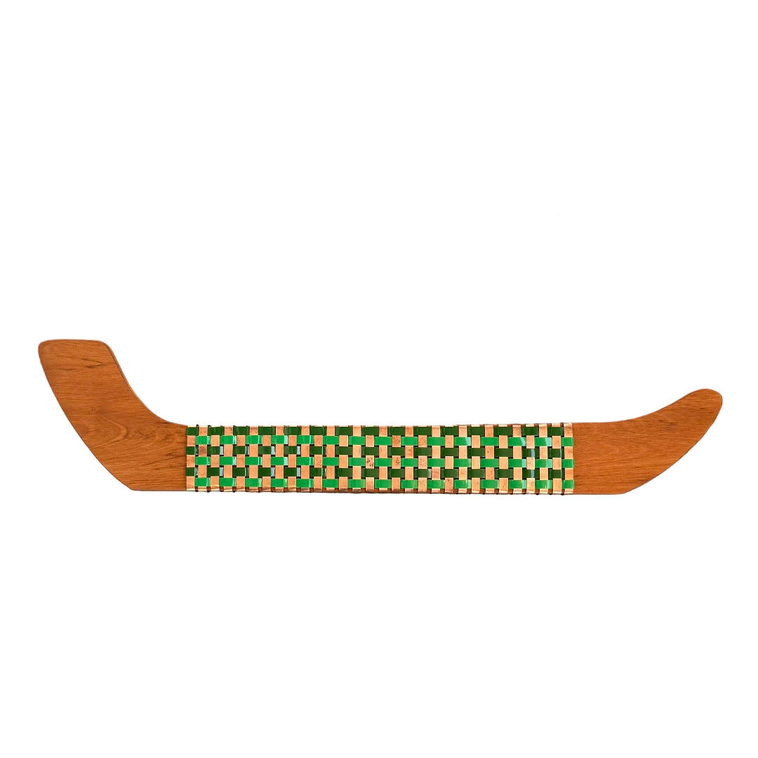 Wooden wall Waka with woven copper & green aluminium pattern on a white background
