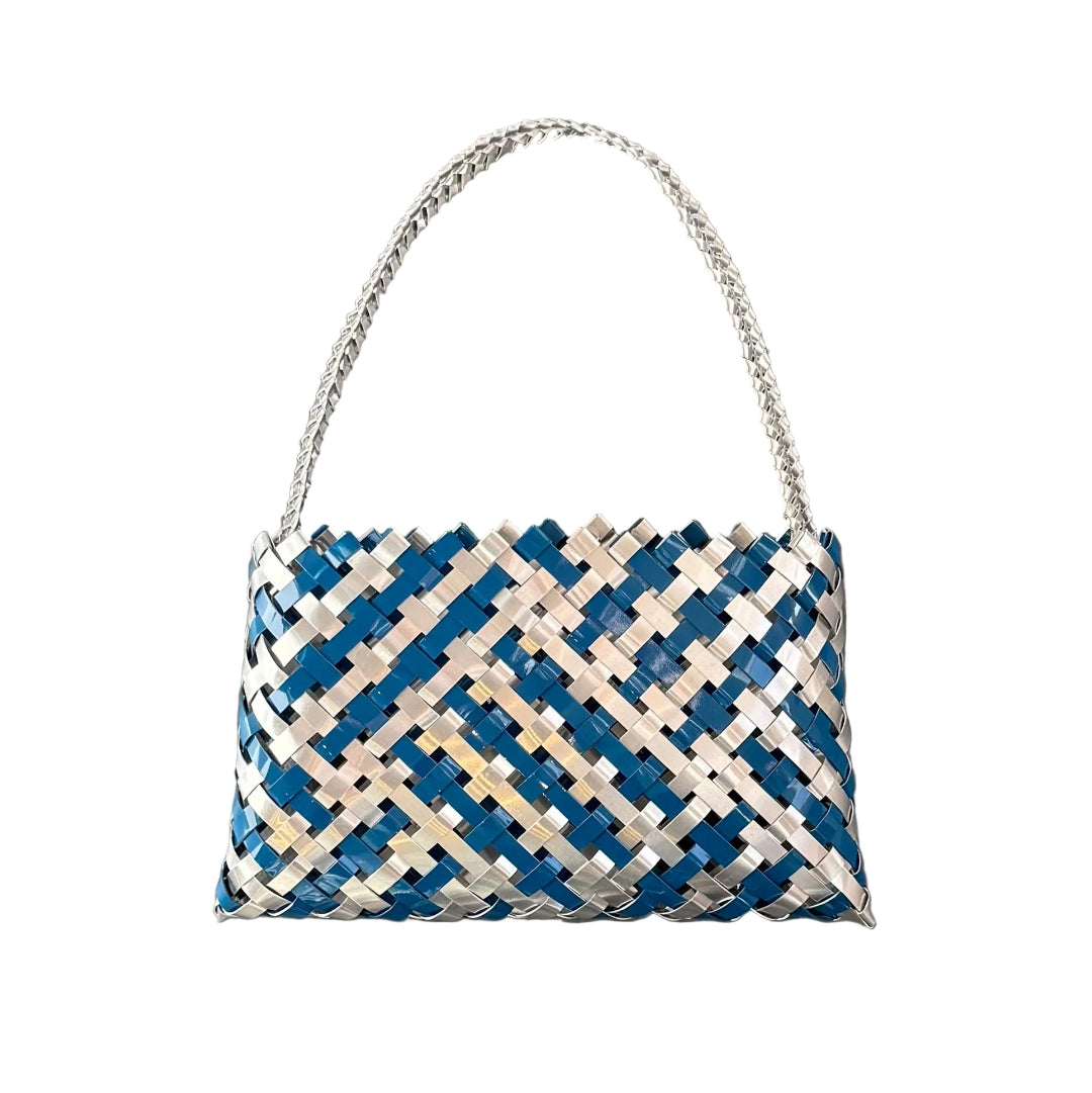 Woven handbag or Kete with blue and white aluminium on a white background