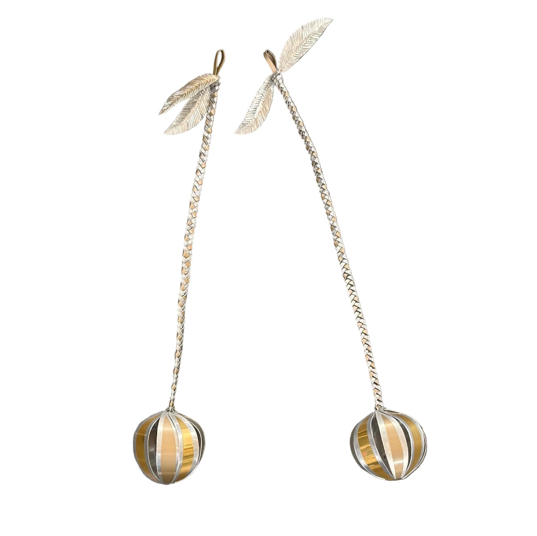 Pair of silver & gold aluminium poi with leaf-like top on a white background