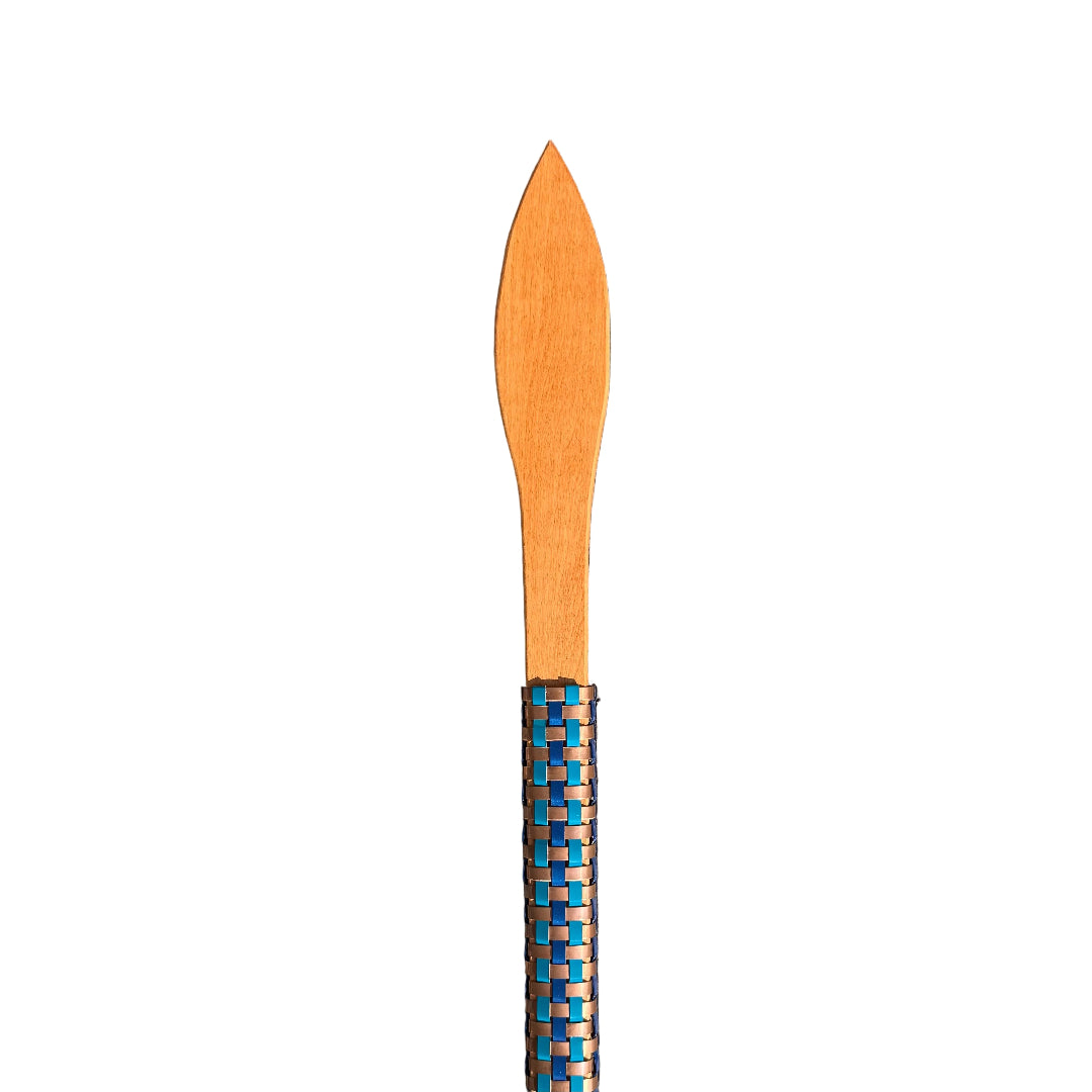 Close up view of half a wooden weapon or Taiha with a pointed end and woven aluminium handle on a white background