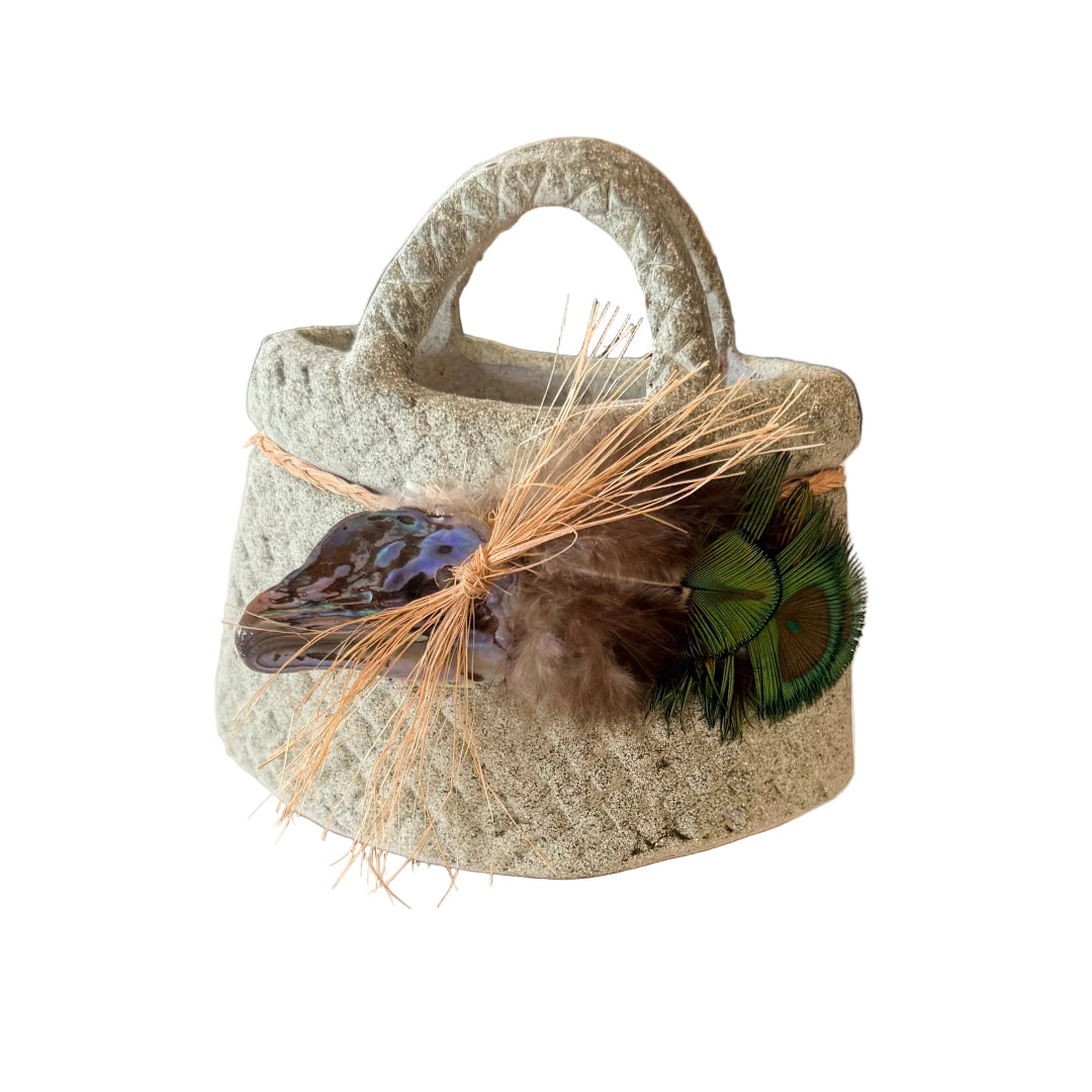 Decorative terracotta basket or kete with peacock feathers and paua shell decorationon 