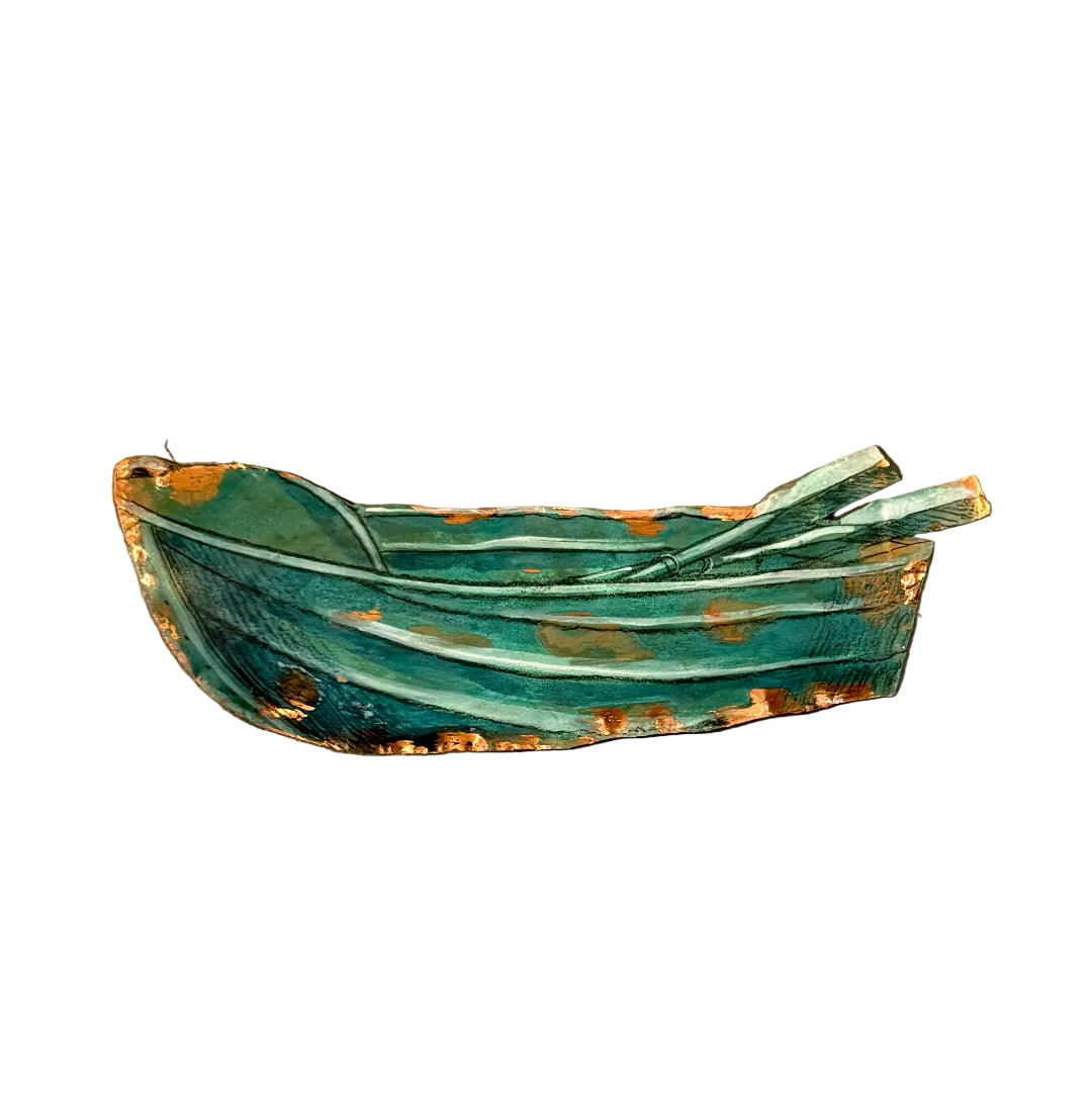 Copper wall scupture of a dinghy on a white background