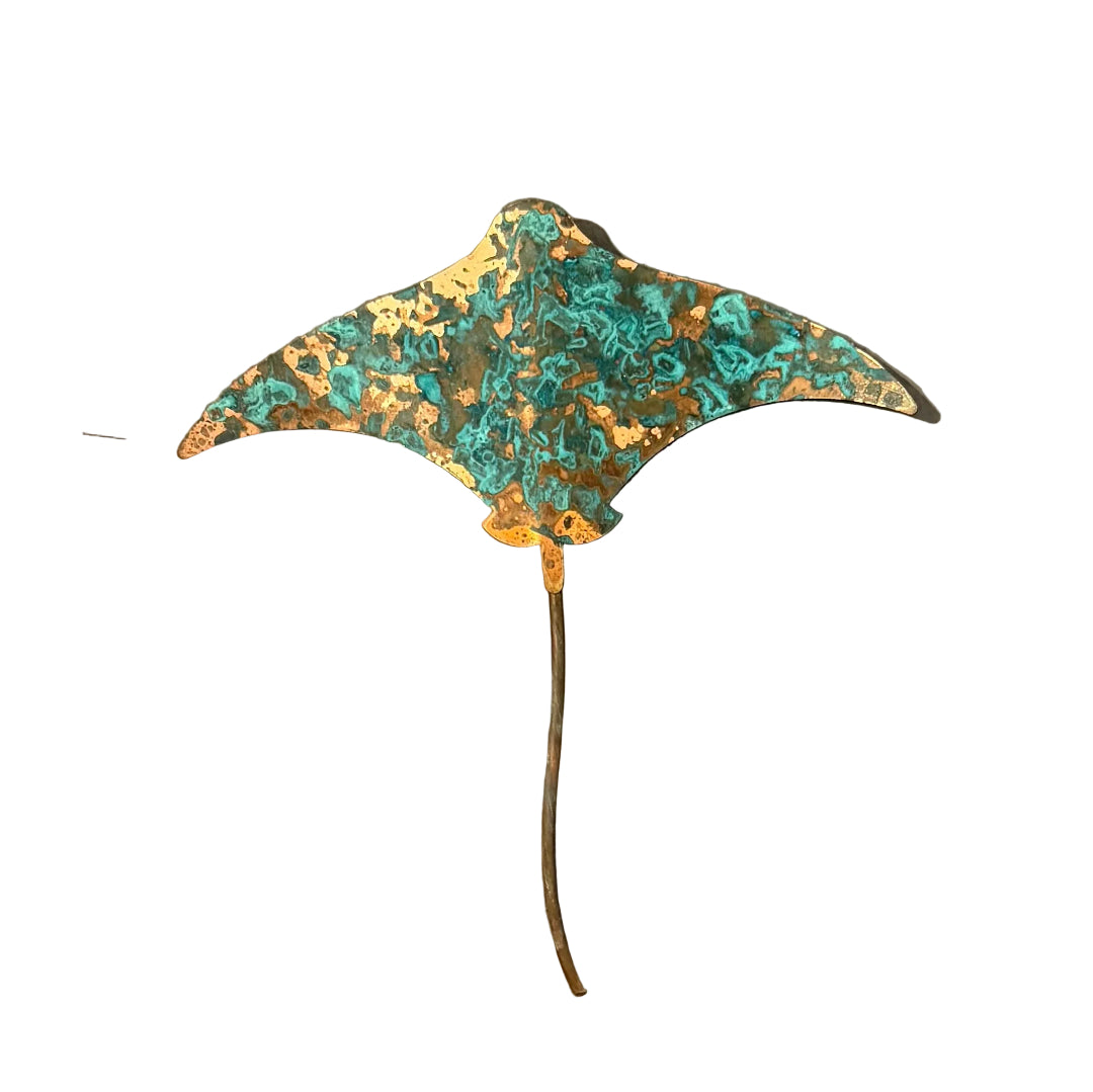 Copper stingray wall sculpture on a white background