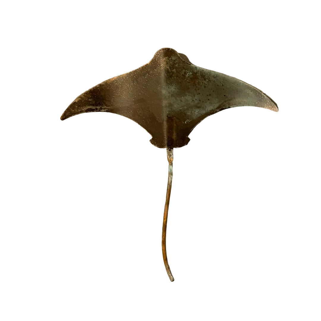 Copper stingray wall sculpture on a white background
