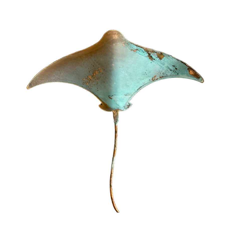 Copper blue and gold stingray wall sculpture on a white surface