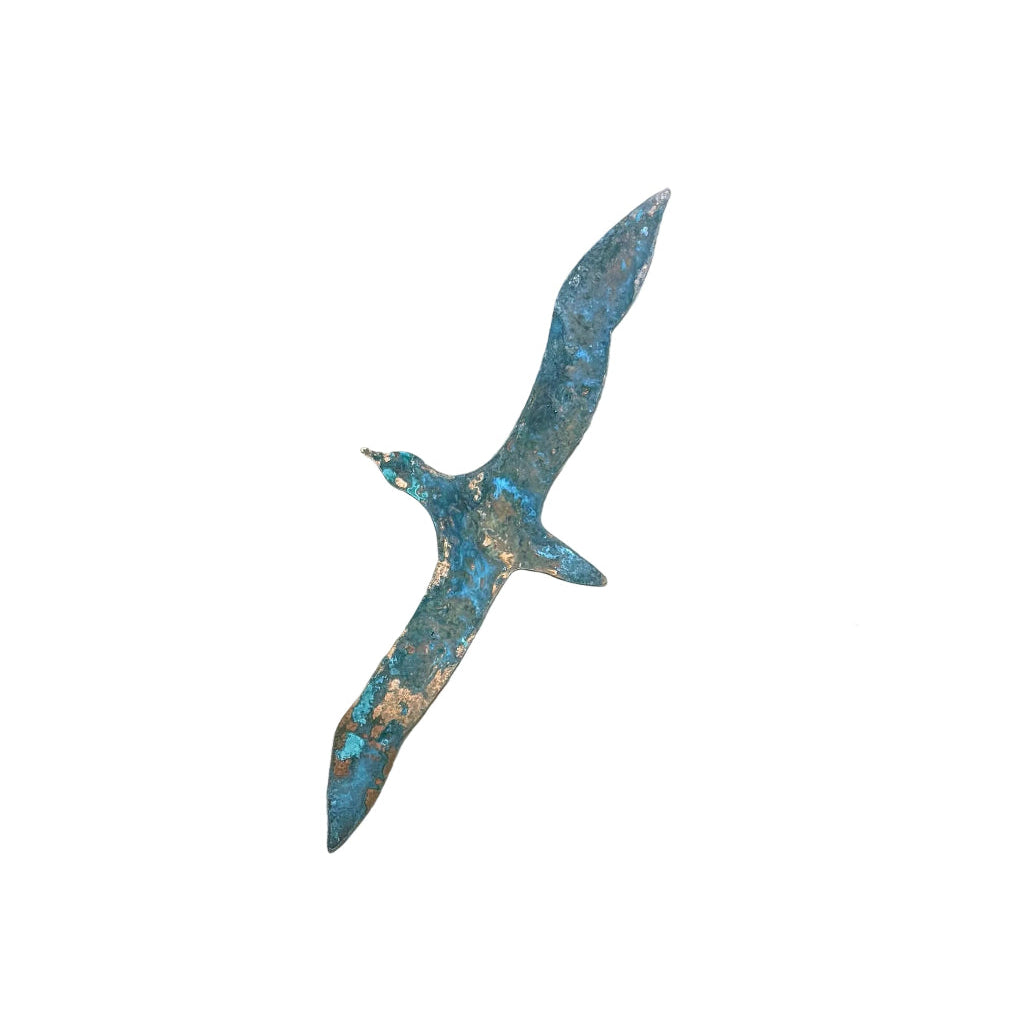 Copper gannet sculpture on a white wall