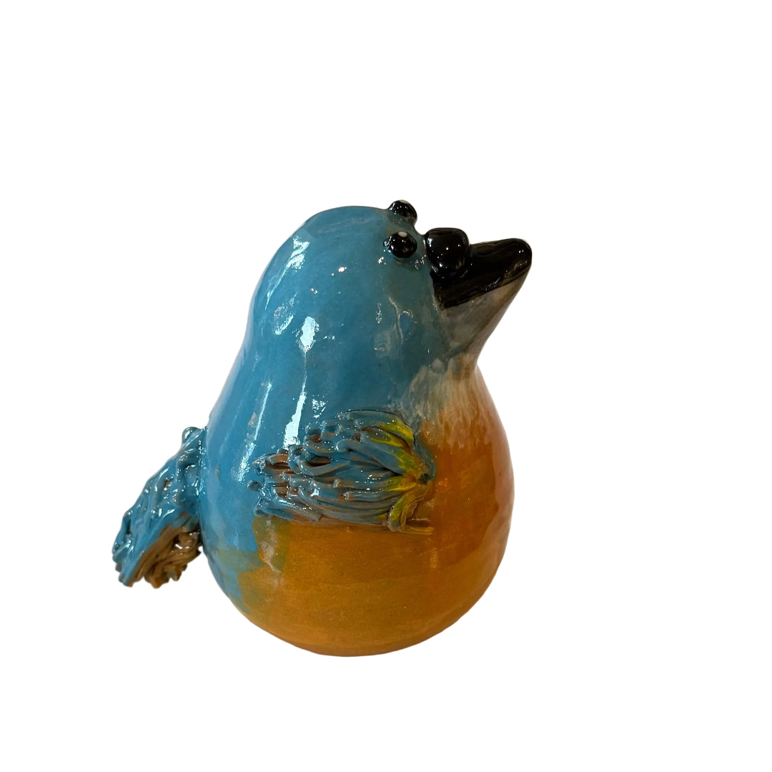 Ceramic Kingfisher bird sculpture with a black beak on a white background
