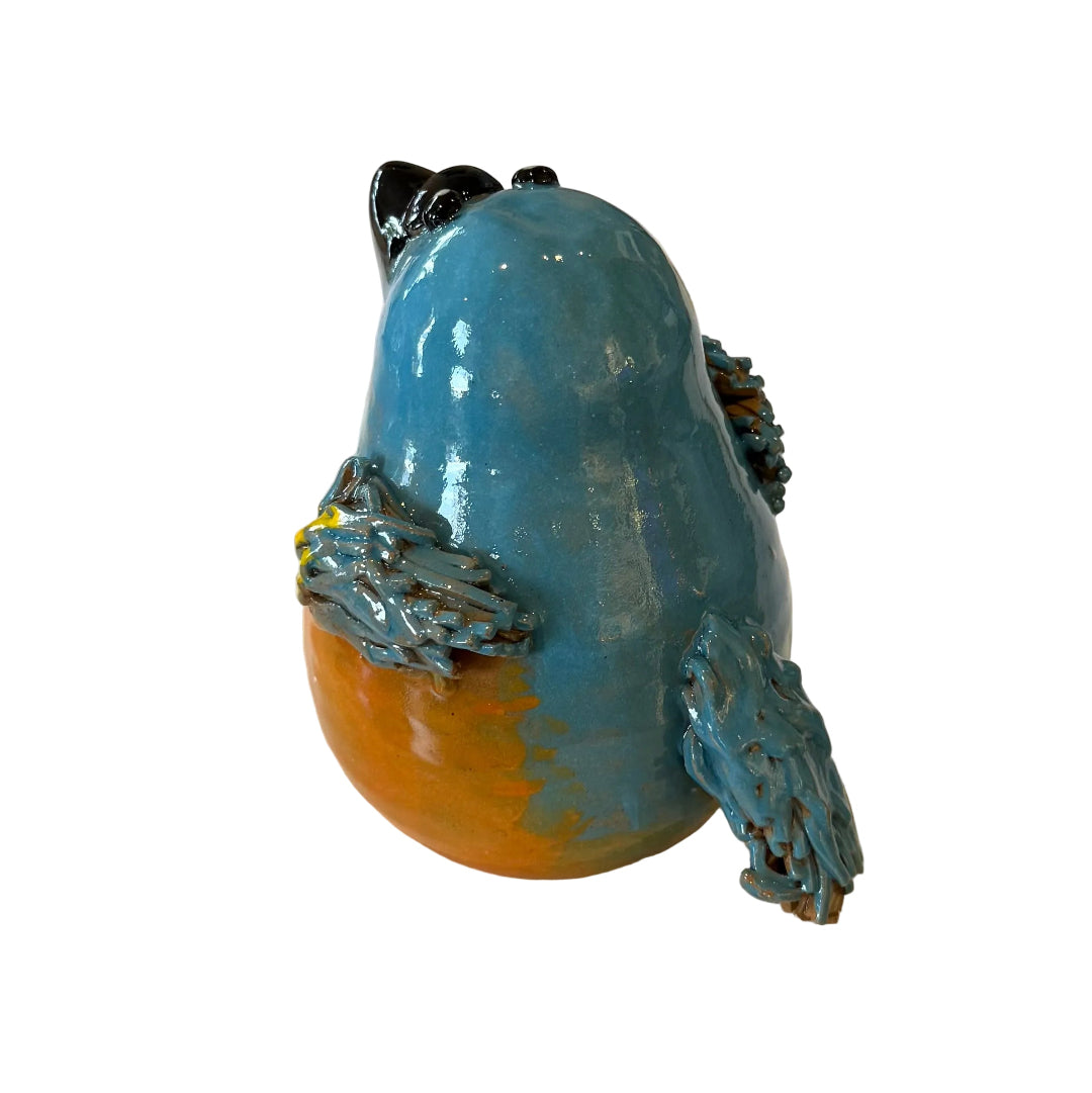 Ceramic Kingfisher bird sculpture with a black beak on a white background