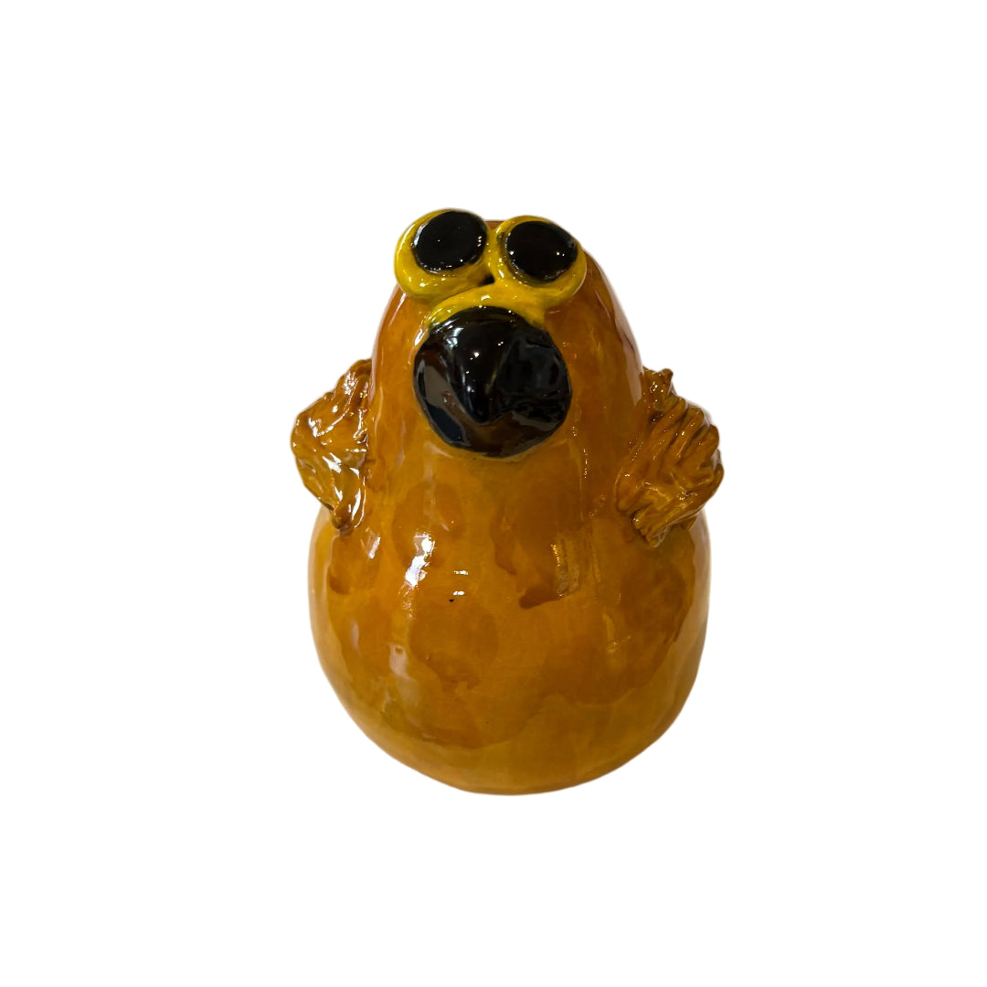 Ceramic Morepork owl sculpture on a white background