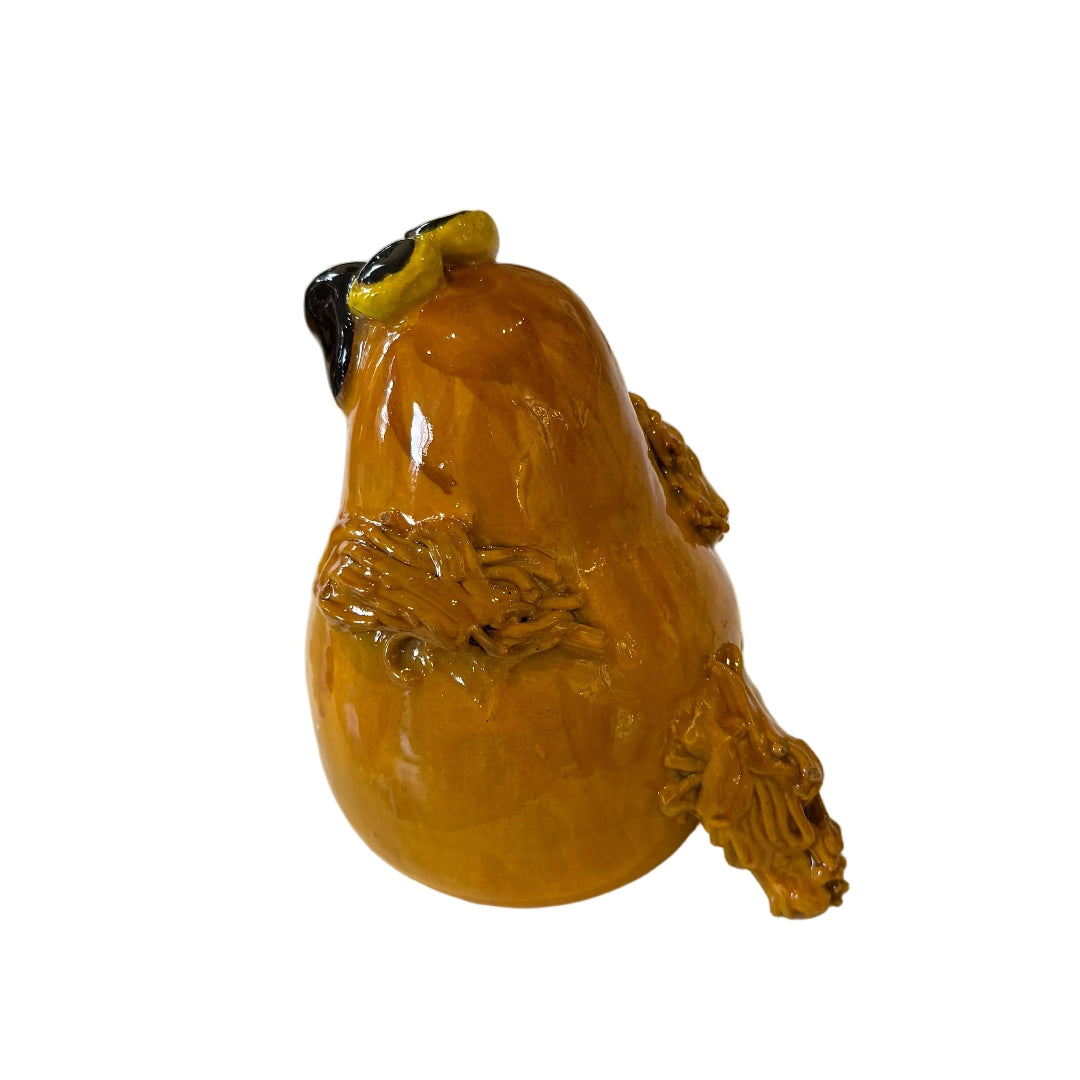 Ceramic Morepork owl sculpture on a white background
