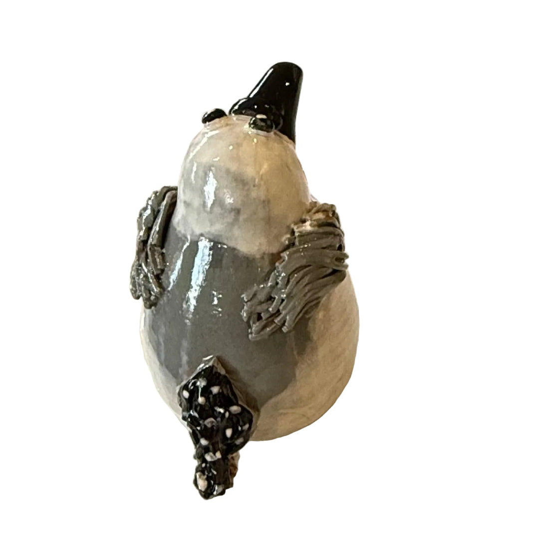 Ceramic Seagull sculpture with a black beak on a white background