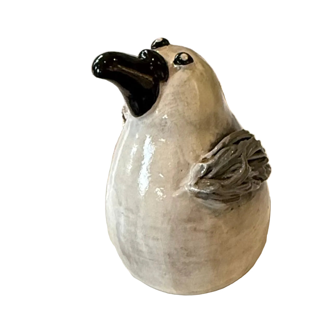 Ceramic Seagull sculpture with a black beak on a white background