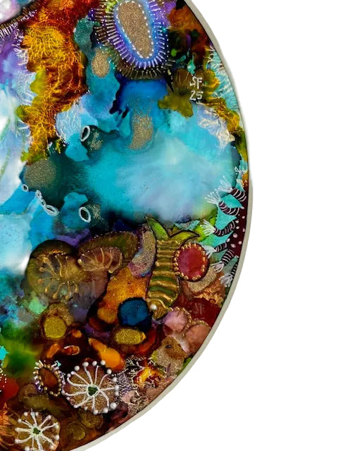 Colorful coral reef artwork with various marine life forms.