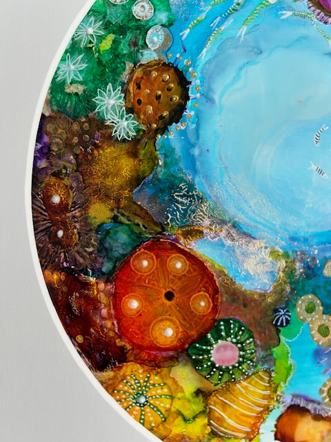 Colorful underwater scene with sea creatures and plants on a textured surface.