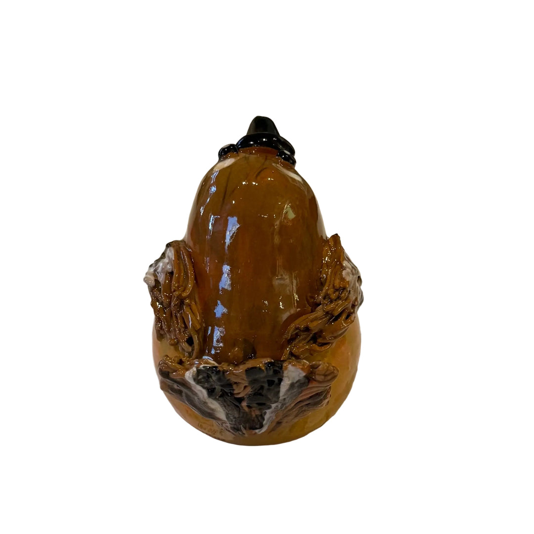 Back view of a ceramic Fantail sculpture on a white background