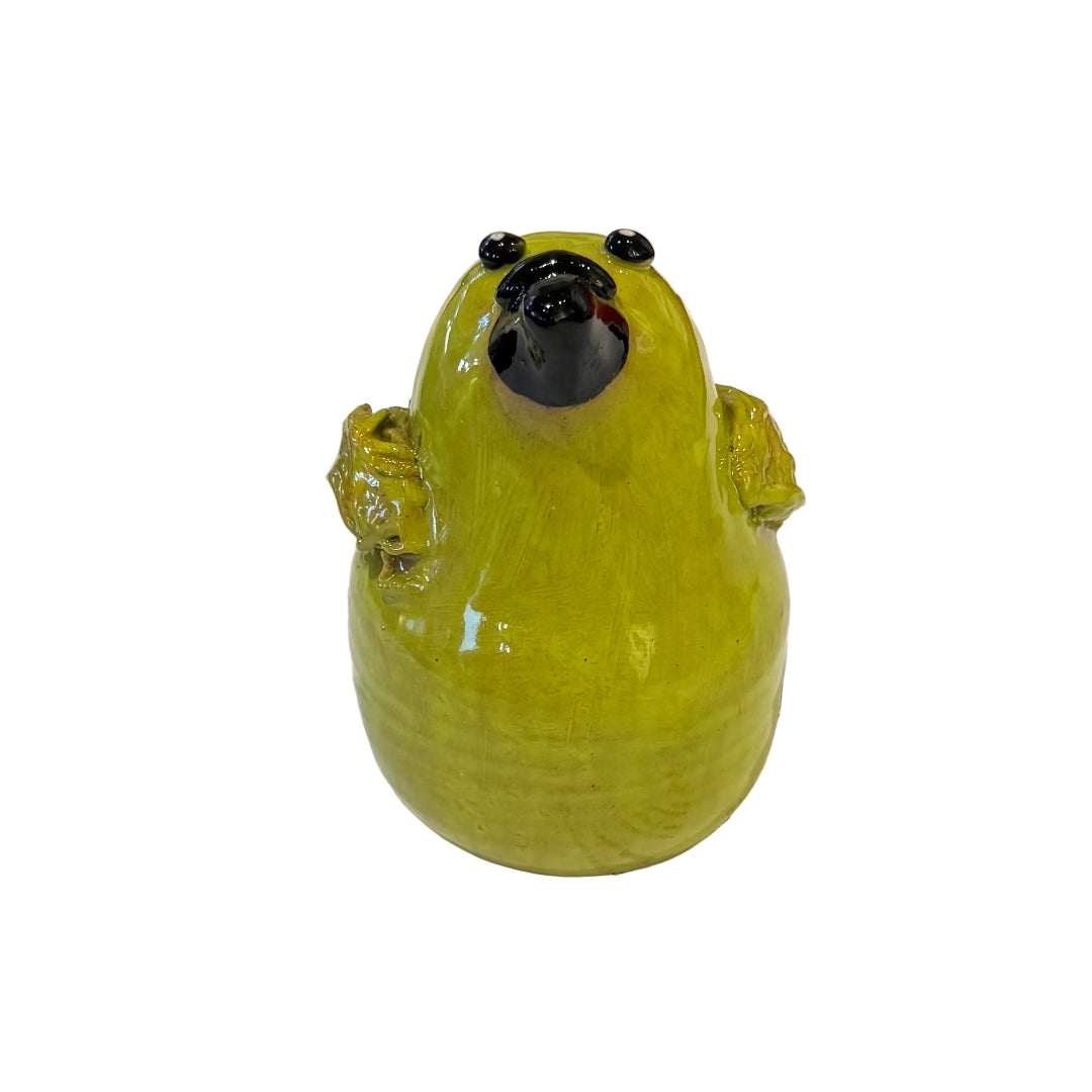 Ceramic Bellbird sculpture with a black beak on a white background