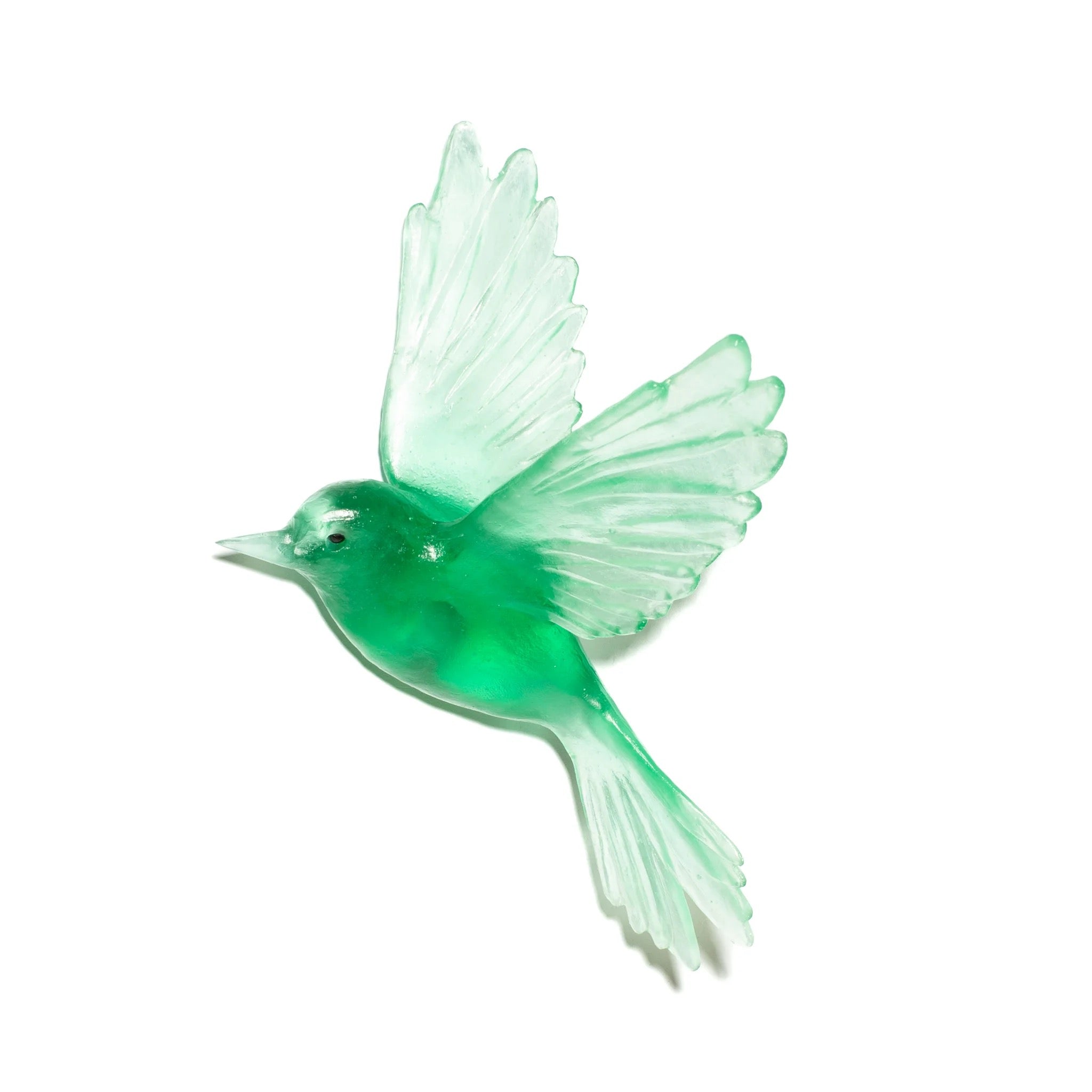 Green glass bird figurine on a white background