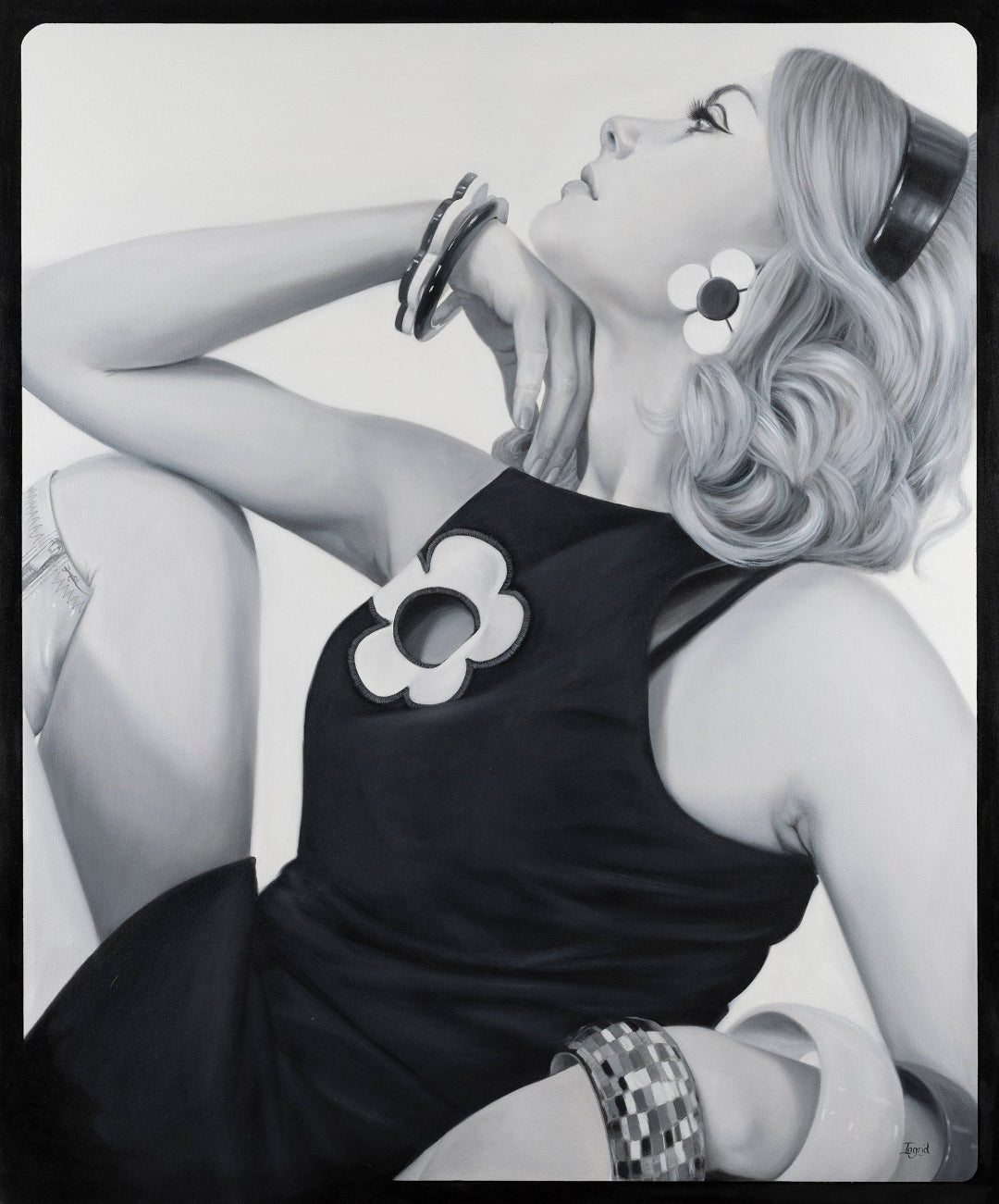 Black and white portrait of a woman with floral earrings and a hat.