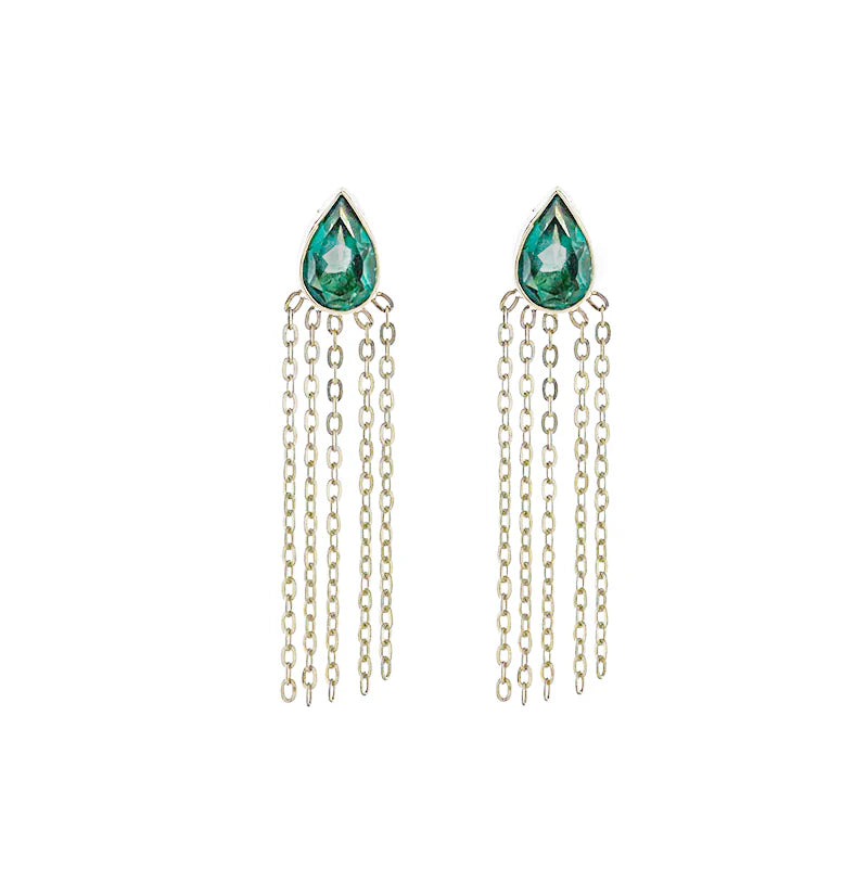 Teardrop-shaped emerald green earrings with silver chains on a white background