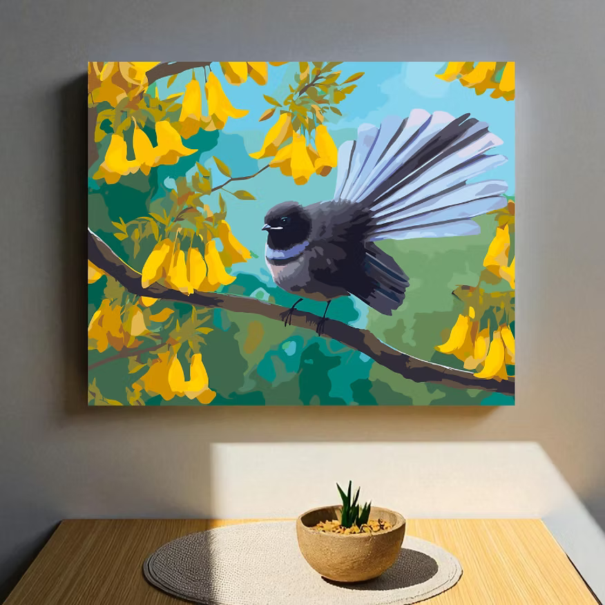 Canvas print of a bird on a branch with yellow flowers and blue sky, hanging on a wall above a table.