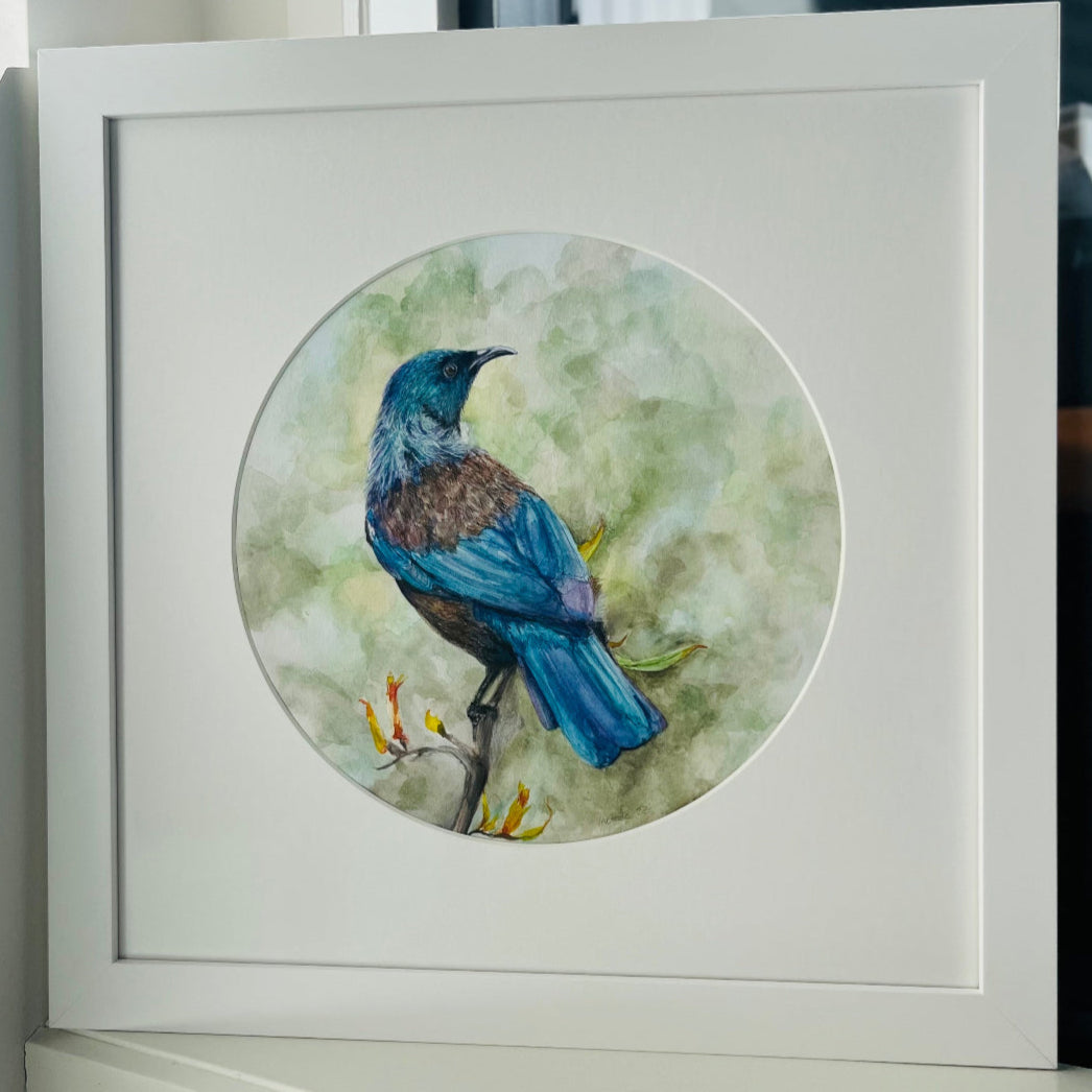 Framed watercolour artwork of a Tui bird on a branch with a white frame.