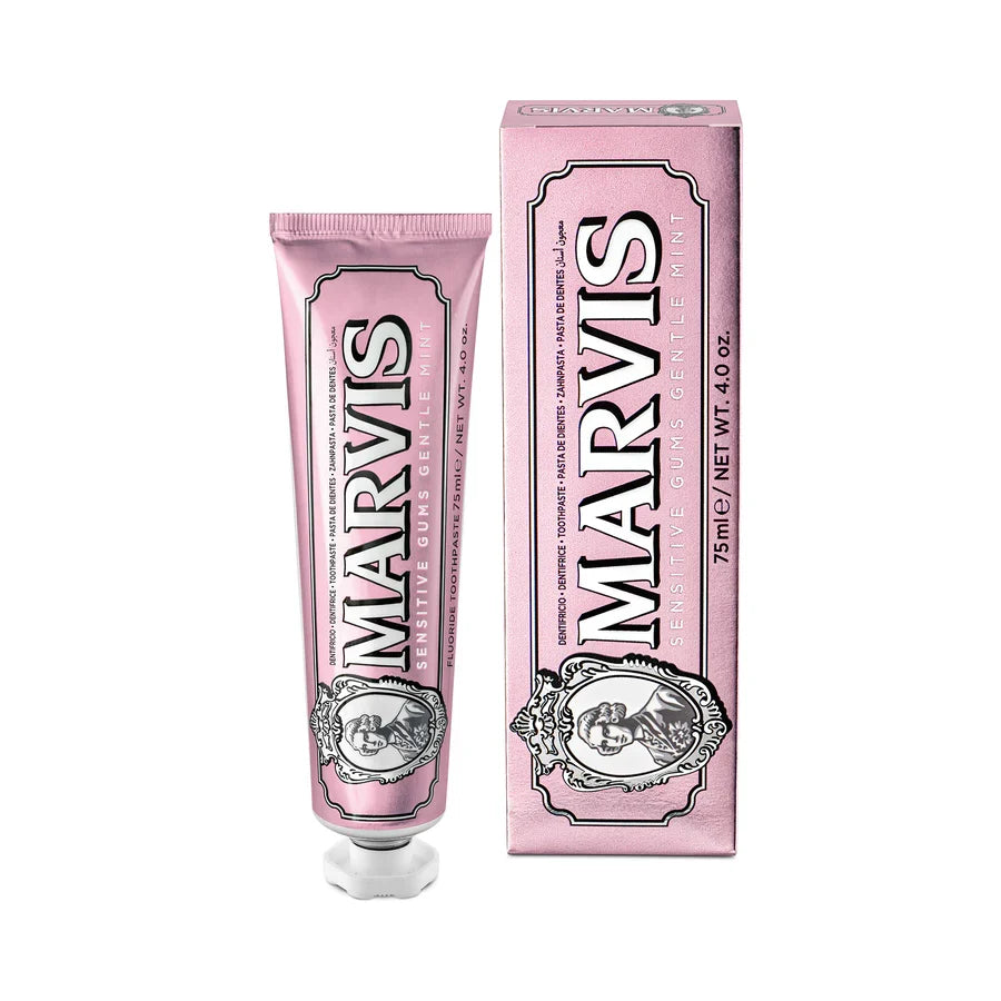 Pink Marvis toothpaste tube and packaging on a white background