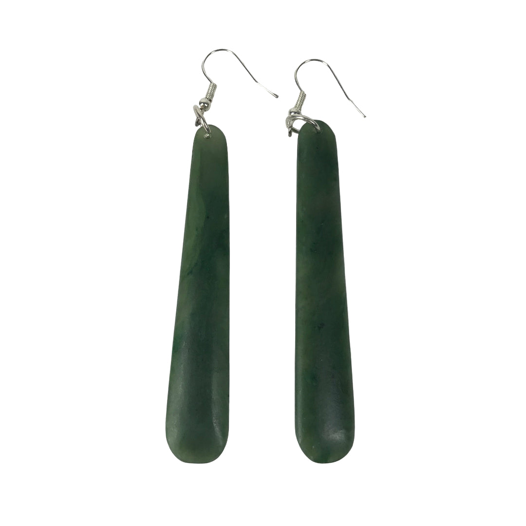 Pair of greenstone earrings on a white background